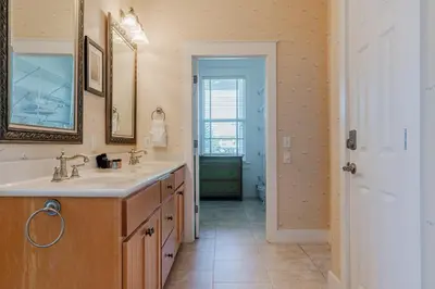 a bathroom with a sink and a mirror at Shore Thing in Rosemary Beach