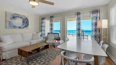 a living room with a couch and a table at Eastern Shores 106 in Santa Rosa Beach