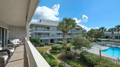 a balcony view of a resort with a swimming pool at Beachwood Villas 11E - SE Seagrove in Santa Rosa Beach