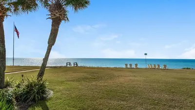 a park with a view of the ocean at Sand Cliffs 106 in Seacrest