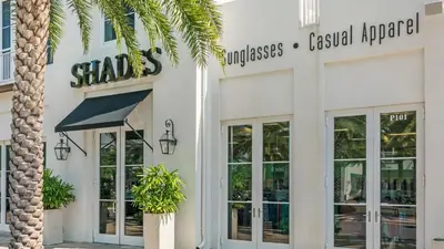 a store with a palm tree in front of it at Sand Cliffs 405 - Sunsets on the Bluff at Sand Cliffs in Seacrest