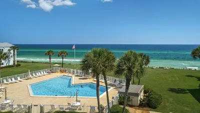 an aerial view of a swimming pool and the beach at Sand Cliffs 405 - Sunsets on the Bluff at Sand Cliffs in Seacrest