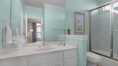 a bathroom with a sink and a shower and a toilet at A Slice of Lime in Santa Rosa Beach