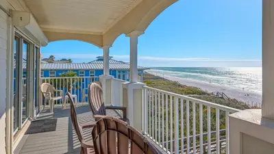 a balcony with chairs and a view of the beach at Seaview I Unit 200 in Santa Rosa Beach