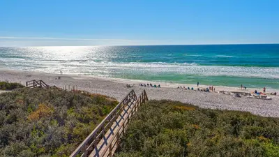 a beach with people on the sand and the ocean at Seaview I Unit 200 in Santa Rosa Beach