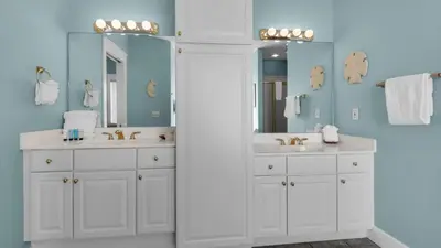 a bathroom with two sinks and a mirror at Seaview I Unit 200 in Santa Rosa Beach