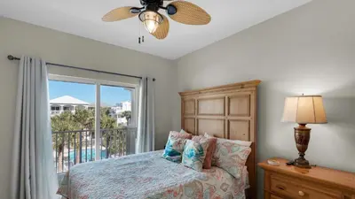 a bedroom with a bed and a window with a view at Seaview I Unit 200 in Santa Rosa Beach