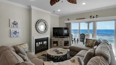 a living room with a couch and a television at Seaview I Unit 200 in Santa Rosa Beach