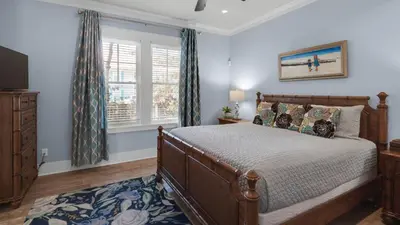 a bedroom with a bed and a window at Ocean Breeze in Santa Rosa Beach