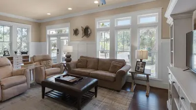 a living room with a couch and a table at Ocean Breeze in Santa Rosa Beach