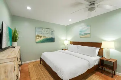 a bedroom with a bed and a ceiling fan at Capistrano E101 in Seacrest