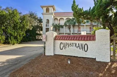 a building with a sign that reads carpentaria at Capistrano E101 in Seacrest