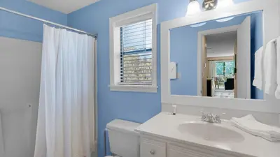 a bathroom with a white sink and a mirror at Beachwood Villas 14B - Simply Seagrove in Santa Rosa Beach