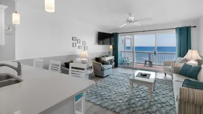 a kitchen and living room with a view of the ocean at Mistral 11 in Seacrest