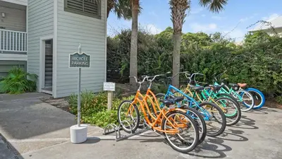 a row of bikes parked outside of a house at Mistral 11 in Seacrest