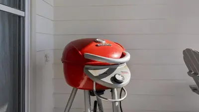 a red helmet sitting on a stool in a room at Blue Nine 5 in Panama City Beach