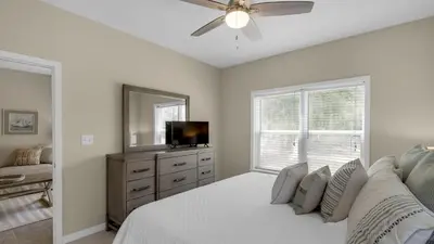 a bedroom with a bed and a ceiling fan at Heron's Watch 5101 in Santa Rosa Beach