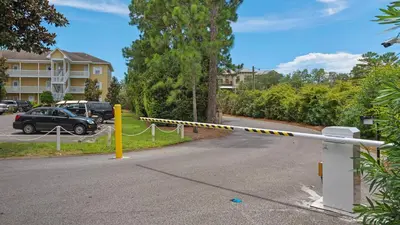 a street with a yellow and white police tape on a street at Heron's Watch 5101 in Santa Rosa Beach
