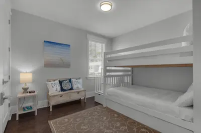 a small bedroom with a bunk bed and a desk at 9 Prairie Pass in Santa Rosa Beach