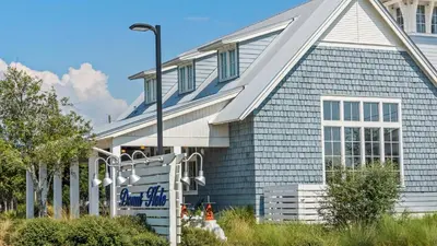 a blue and white house with a street light at Our Blue Haven in Inlet Beach