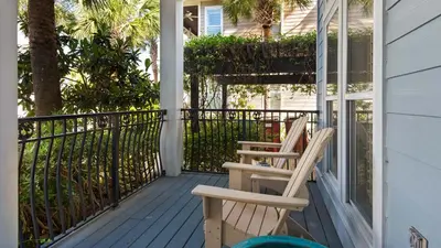 two chairs sitting on the front porch of a house at Our Blue Haven in Inlet Beach