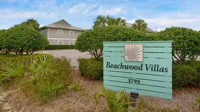 a sign for beachwood villas in front of a house at Beachwood Villas #9E - Sandy Cheeks in Santa Rosa Beach