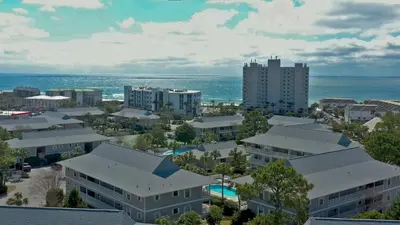 an aerial view of a city with buildings and the ocean at Beachwood Villas #9E - Sandy Cheeks in Santa Rosa Beach