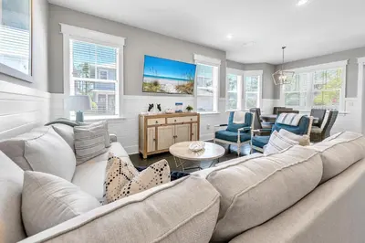 a living room with a large couch and chairs at Bluegrass by the Sea in Santa Rosa Beach