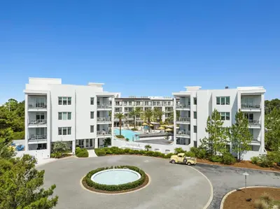 an aerial view of an apartment complex with a parking lot at The Pointe on 30A by Panhandle Getaways in Rosemary Beach