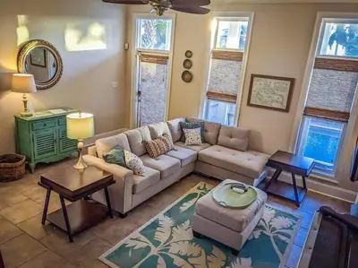 a living room with a couch and a table at Amzg Gulf view,4 Bd/3.5 Bath Home, Pvt heated Pool in Panama City Beach