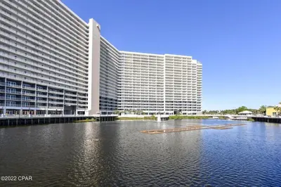 a large building in front of a large body of water at Beautiful Condo with Ocean View from 15th Floor in Panama City Beach