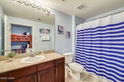 a bathroom with a sink and a toilet and a shower at Beautiful Condo with Ocean View from 15th Floor in Panama City Beach