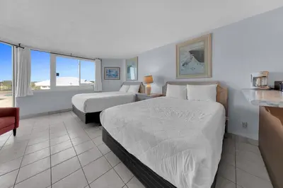 a hotel room with two beds and a window at Top of the Gulf 416 in Panama City Beach