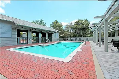 a swimming pool in the middle of a house at Magnolia Cottages by the Sea by Panhandle Getaways in Seacrest