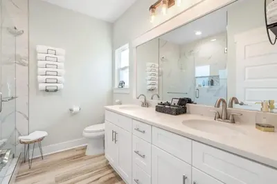 a white bathroom with a sink and a toilet at Emerald-Gem-Inn • Laguna Haven/Beach Home! in Panama City Beach