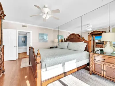 a bedroom with a bed and a ceiling fan at Majestic Beach Towers 1-1701 in Panama City Beach
