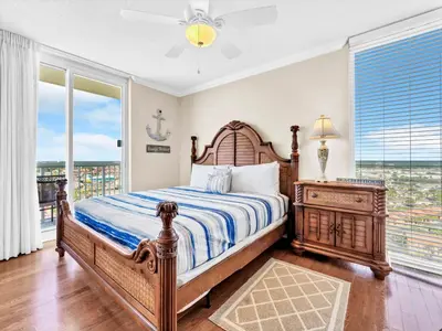 a bedroom with a bed and a window at Majestic Beach Towers 1-1701 in Panama City Beach