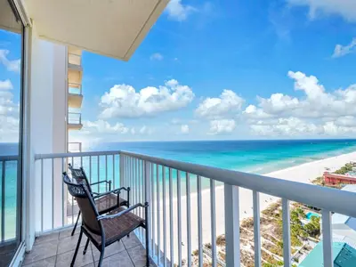 a balcony with a chair and the ocean at Majestic Beach Towers 1-1701 in Panama City Beach