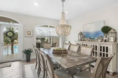 a dining room with a table and chairs at Villas at Seacrest by Panhandle Getaways in Seacrest