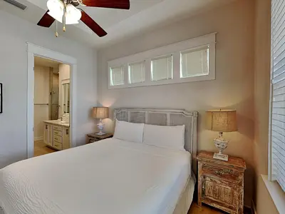 a bedroom with a white bed and a ceiling fan at Prominence North #89C - Sun Times in Watersound Beach