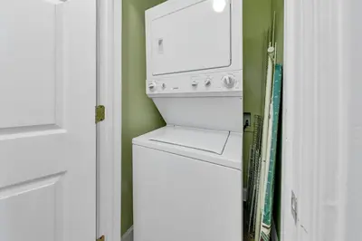 a white washer and dryer in a room at Emerald Isle 1201 in Panama City Beach