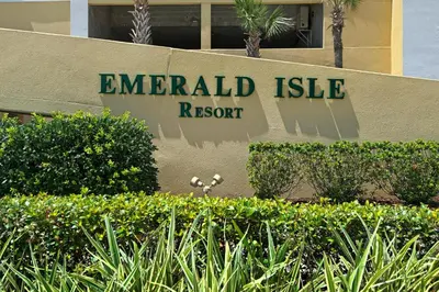 a sign that reads emerald isle resort on a building at Emerald Isle 1201 in Panama City Beach