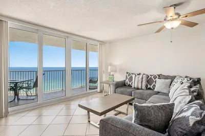 a living room with a couch and a view of the ocean at Enjoy A Birds Eye View at Panama City Beach in Panama City Beach