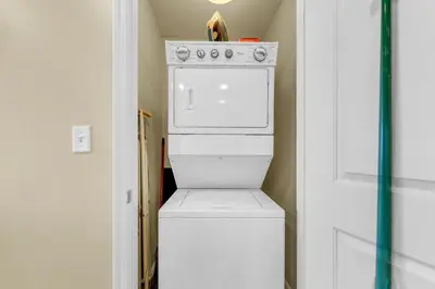 a white washer and dryer in a room at Sterling Breeze 1204 in Panama City Beach