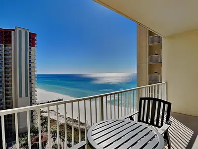 a balcony with a chair and a view of the beach at Shores of Panama #1406 in Panama City Beach