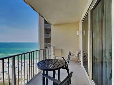 a balcony with a table and chairs and the ocean at Shores of Panama #1406 in Panama City Beach