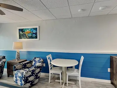 a waiting room with a table and two chairs at Continental 206 in Panama City Beach