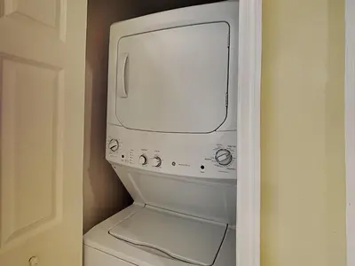 a white washer and dryer in a closet at Majestic Beach Towers I #1414 in Panama City Beach