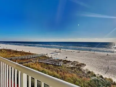 a view of the beach from the balcony of a condo at Majestic Beach Towers I #311 in Panama City Beach