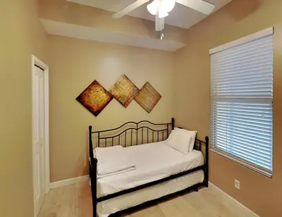 a bedroom with a bed and a window at Grandview East #1305 in Panama City Beach